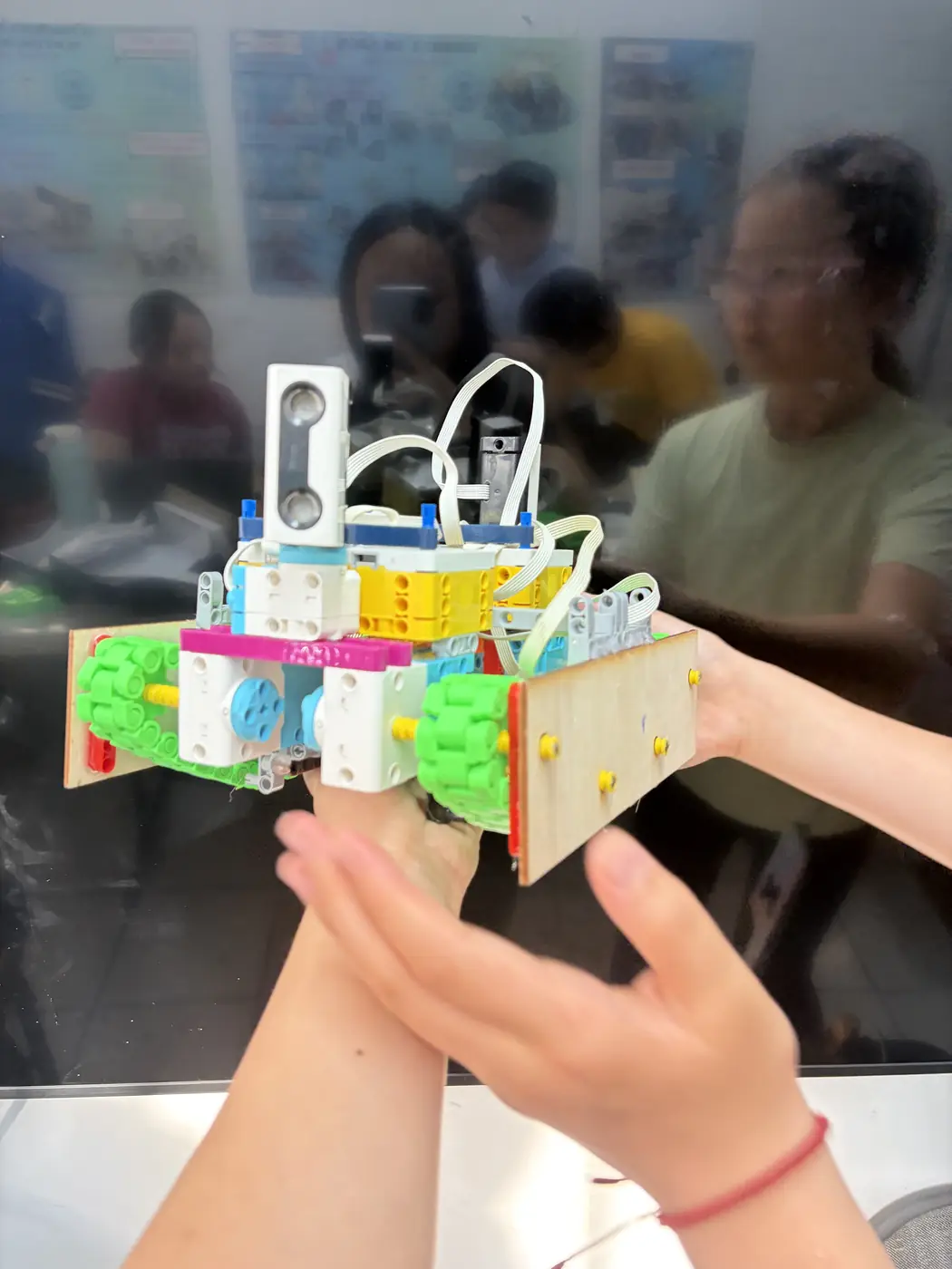 Team holding the current innovation rover prototype